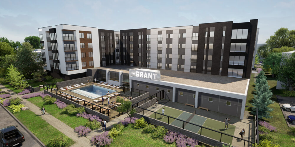 Aerial view of apartment, pickleball court, and pool